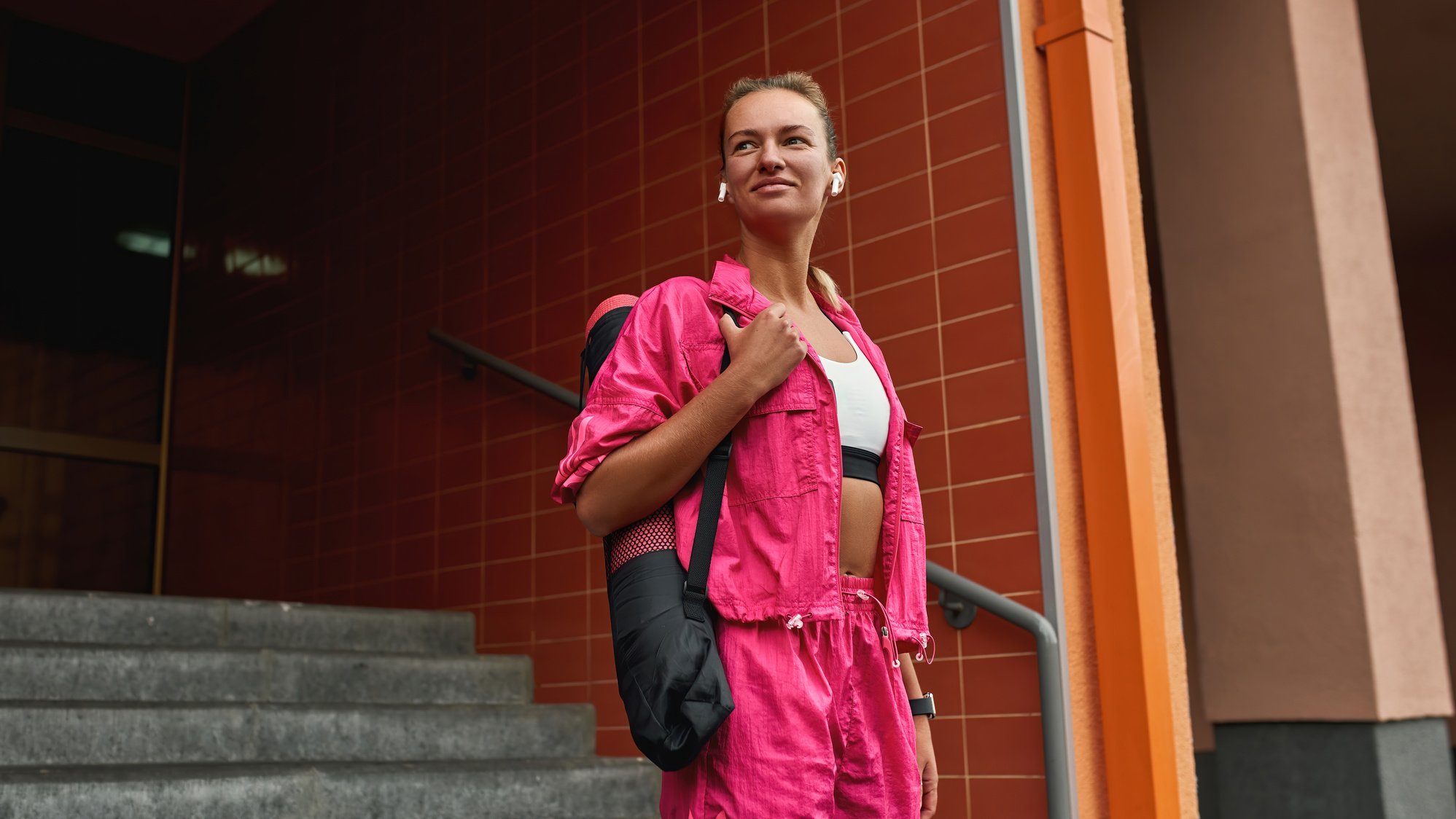 Girl wearing wireless earbuds listening to music